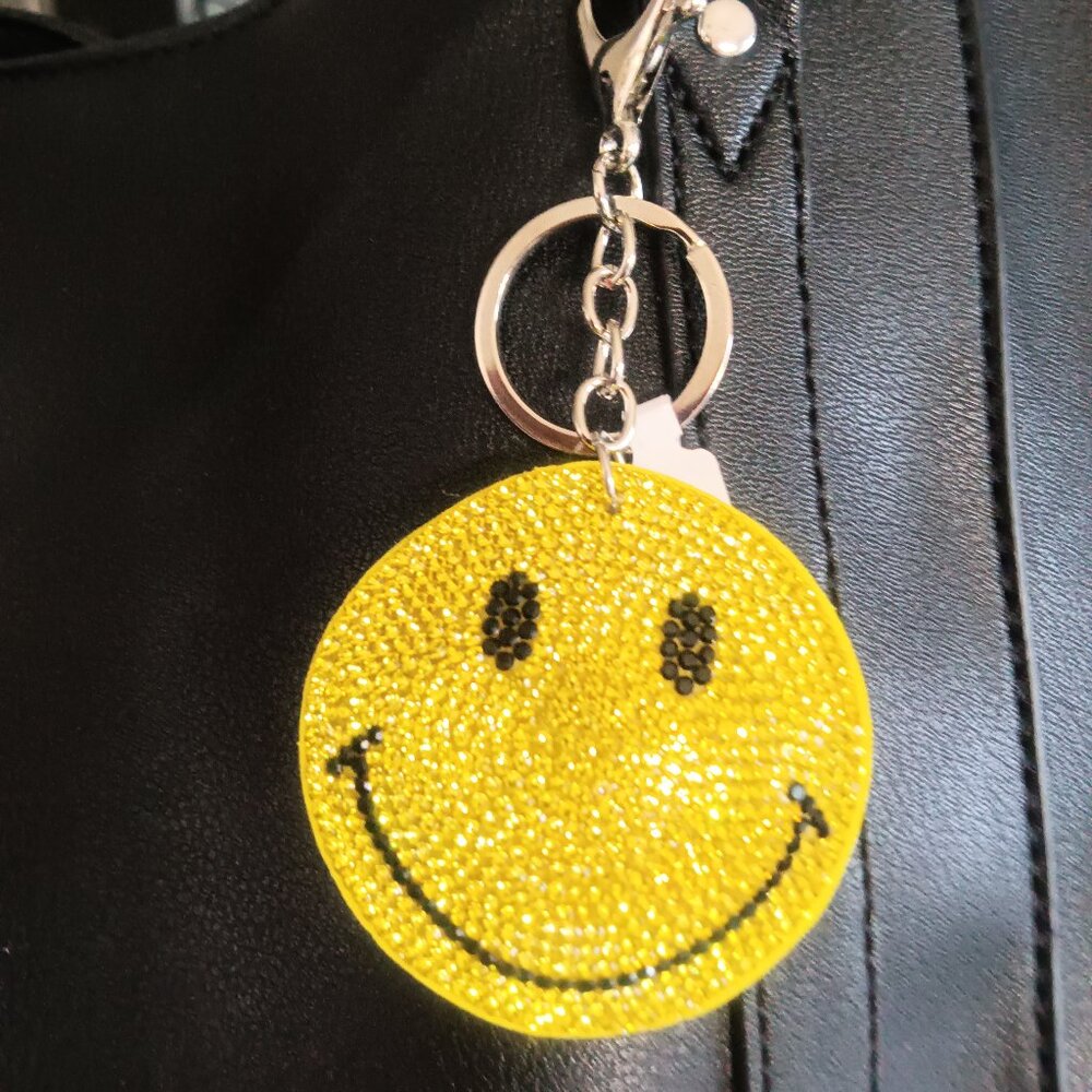 A two pack of Crystal embellished Smiley face bag charms/key holders